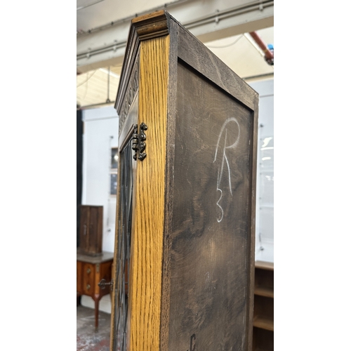 21 - A Jaycee carved oak and lead glazed corner display cabinet - approx. 171cm high x 67cm wide x 40cm d... 