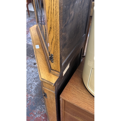 21 - A Jaycee carved oak and lead glazed corner display cabinet - approx. 171cm high x 67cm wide x 40cm d... 