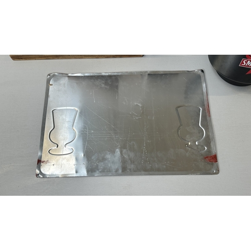 61 - Four advertising items, one Coca-Cola black plastic and metal bottle opener, one Smirnoff black plas... 