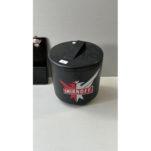 61 - Four advertising items, one Coca-Cola black plastic and metal bottle opener, one Smirnoff black plas... 