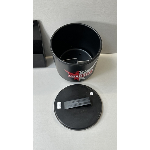 61 - Four advertising items, one Coca-Cola black plastic and metal bottle opener, one Smirnoff black plas... 