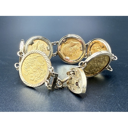 2113 - A 9ct gold bracelet containing six George V 22ct gold full sovereigns, one 1911, two 1912, one 1913,...