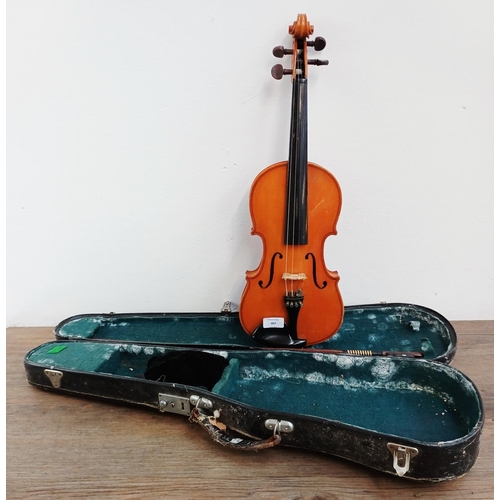 367 - A cased violin with bow