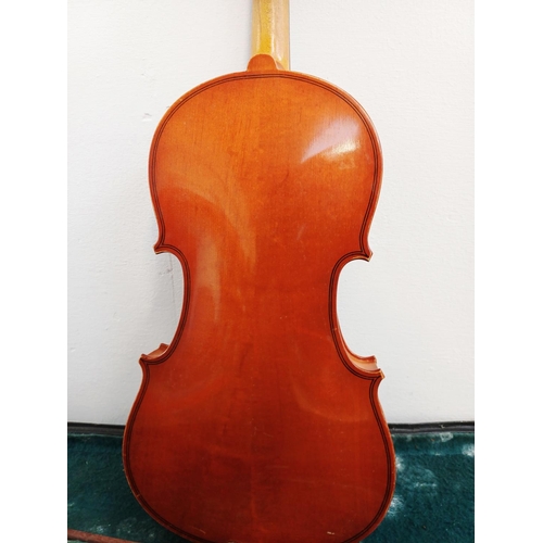 367 - A cased violin with bow