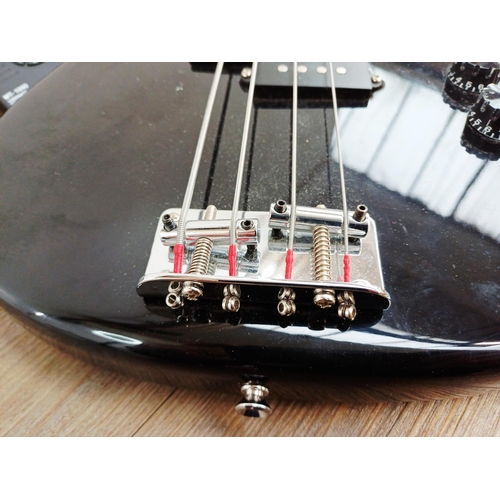 369 - A cased Encore short-scale electric bass guitar with EzetunE MT-1000 electronic chromatic tuner and ... 