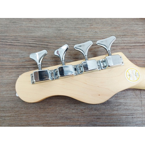 369 - A cased Encore short-scale electric bass guitar with EzetunE MT-1000 electronic chromatic tuner and ... 