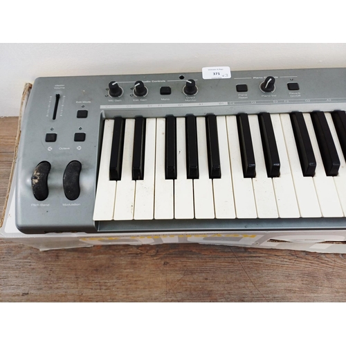 371 - Three boxed items of music technology, one M-Audio Axiom Air 25 premium keyboard controller, one M-A... 