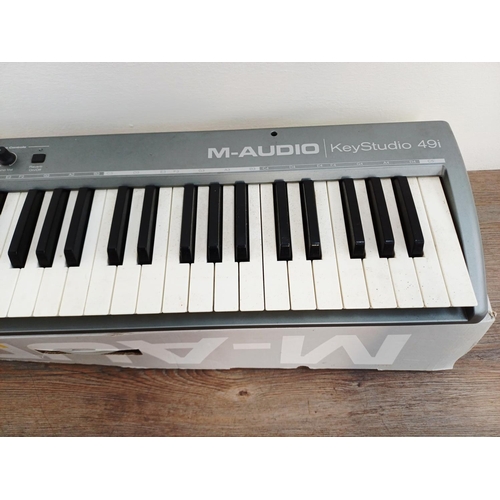 371 - Three boxed items of music technology, one M-Audio Axiom Air 25 premium keyboard controller, one M-A... 