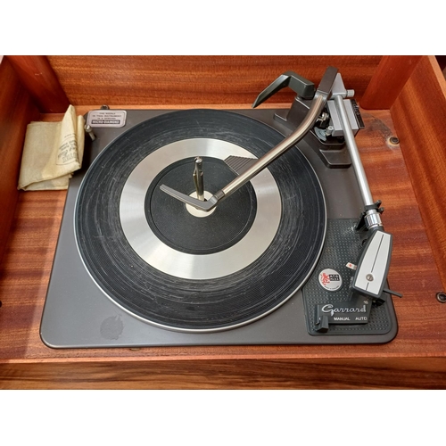 386 - A Dynatron Radio Ltd. record player with Garrard AT6 Mk.IIA four-speed auto-changer turntable
