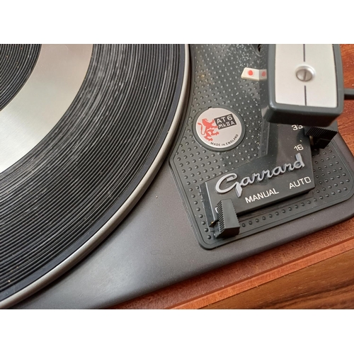 386 - A Dynatron Radio Ltd. record player with Garrard AT6 Mk.IIA four-speed auto-changer turntable
