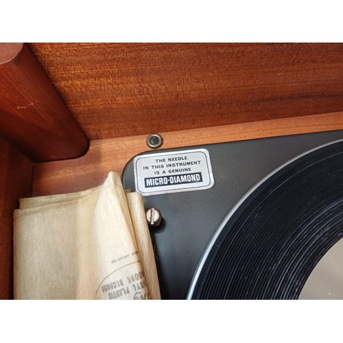 386 - A Dynatron Radio Ltd. record player with Garrard AT6 Mk.IIA four-speed auto-changer turntable