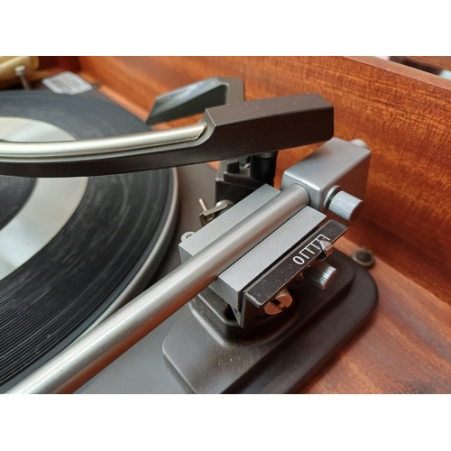 386 - A Dynatron Radio Ltd. record player with Garrard AT6 Mk.IIA four-speed auto-changer turntable