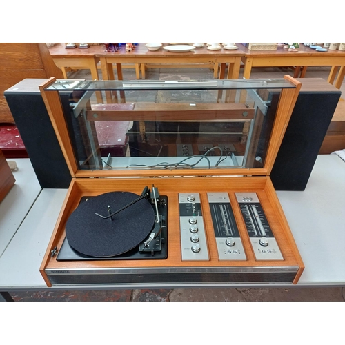 387 - A Deccasound Compact 3 music centre comprising BSR four-speed auto-changer turntable, FM/LW/MW/SW re... 