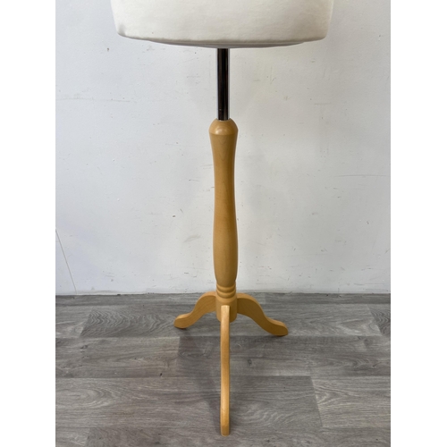 97 - A modern white fabric female mannequin torso on beech tripod stand - approx. 158cm high