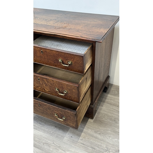 108 - A Georgian oak dresser base - approx. 82cm high x 207cm wide x 52cm deep