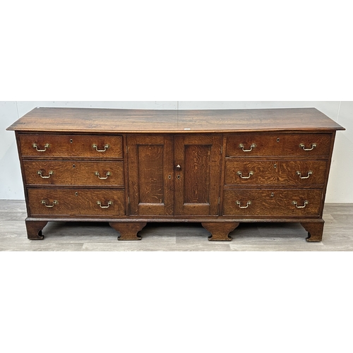 108 - A Georgian oak dresser base - approx. 82cm high x 207cm wide x 52cm deep