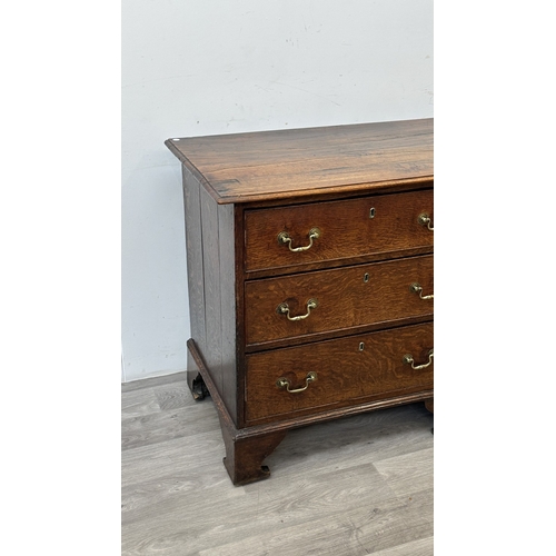 108 - A Georgian oak dresser base - approx. 82cm high x 207cm wide x 52cm deep