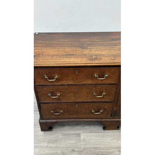 108 - A Georgian oak dresser base - approx. 82cm high x 207cm wide x 52cm deep