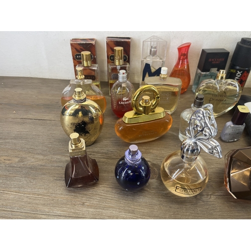 267 - A collection of perfumes and aftershaves to include Ted Baker London, Tom Ford, Joop! Homme etc.