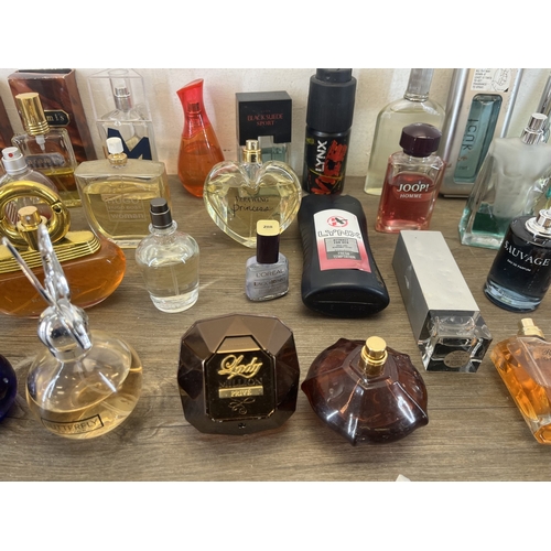 267 - A collection of perfumes and aftershaves to include Ted Baker London, Tom Ford, Joop! Homme etc.