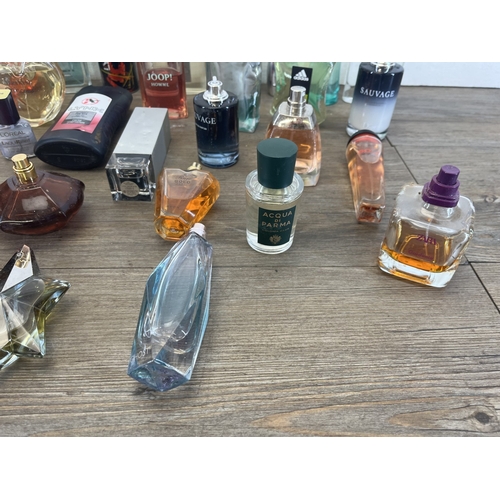 267 - A collection of perfumes and aftershaves to include Ted Baker London, Tom Ford, Joop! Homme etc.