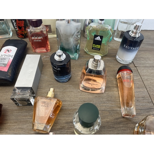 267 - A collection of perfumes and aftershaves to include Ted Baker London, Tom Ford, Joop! Homme etc.