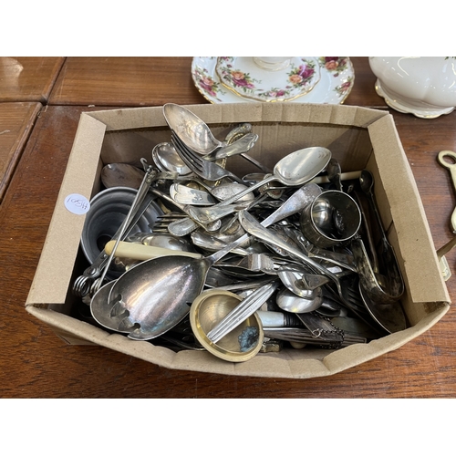 250 - A collection of antique and later metalware to include horse brasses, silver plated cutlery, French ... 