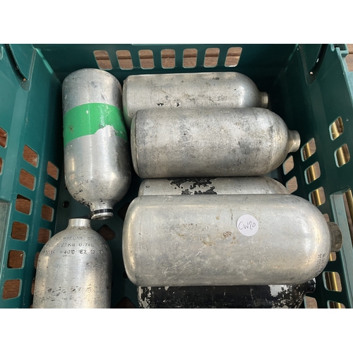 252 - Nine metal gas cylinders - approx. 21cm high