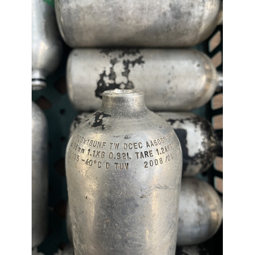 252 - Nine metal gas cylinders - approx. 21cm high