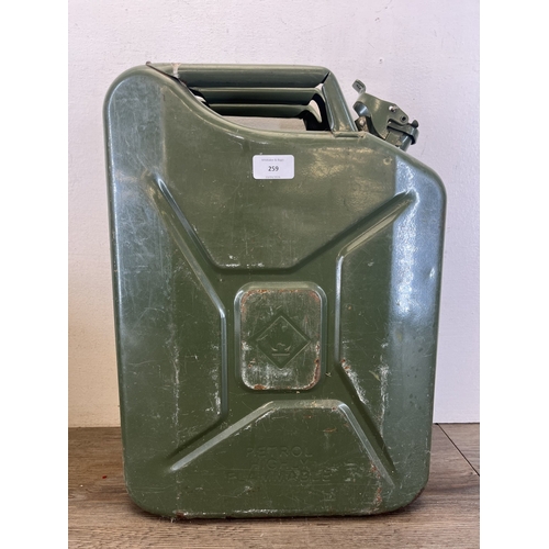 259 - Two fuel cans, one early/mid 20th century Shell and one 20L green steel