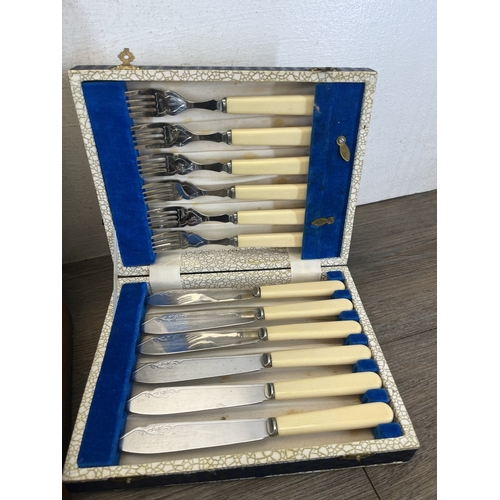 260 - Four boxes containing metalware, three containing cutlery and one containing pewter ware to include ... 