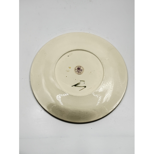 161 - A Moorcroft Bermuda Lily pattern circular plate - approx. 31cm diameter