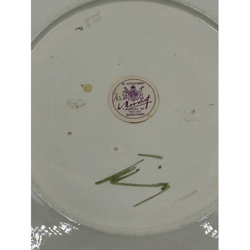 161 - A Moorcroft Bermuda Lily pattern circular plate - approx. 31cm diameter