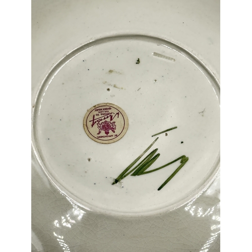 162 - A Moorcroft Bermuda Lily pattern circular plate - approx. 31cm diameter