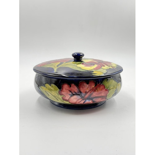 172 - A Moorcroft Hibiscus pattern circular lidded bowl - approx. 9cm high x 17cm diameter