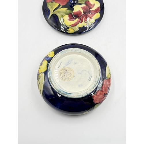 172 - A Moorcroft Hibiscus pattern circular lidded bowl - approx. 9cm high x 17cm diameter