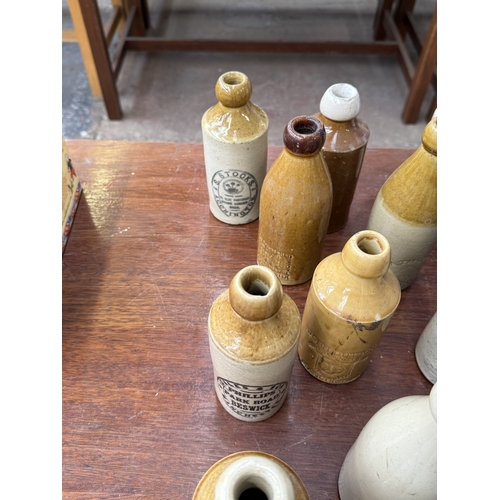 224 - Fourteen late 19th/early 20th century salt glazed stoneware bottles