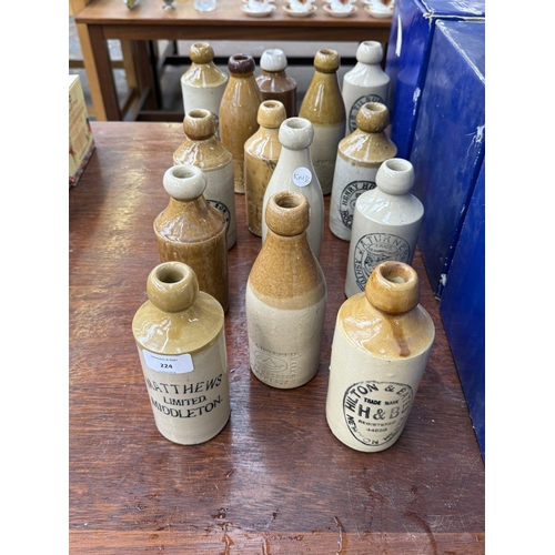 224 - Fourteen late 19th/early 20th century salt glazed stoneware bottles