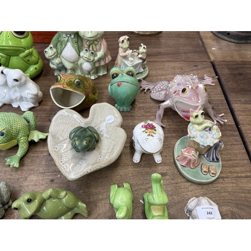 242 - Approx. thirty nine various frog figurines to include ceramic, resin etc. together with a ceramic sn... 