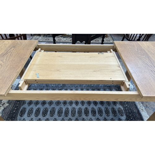 100 - A 1990s Habitat oak extending dining table designed by Terence Conran, made in Denmark - approx. 74c... 