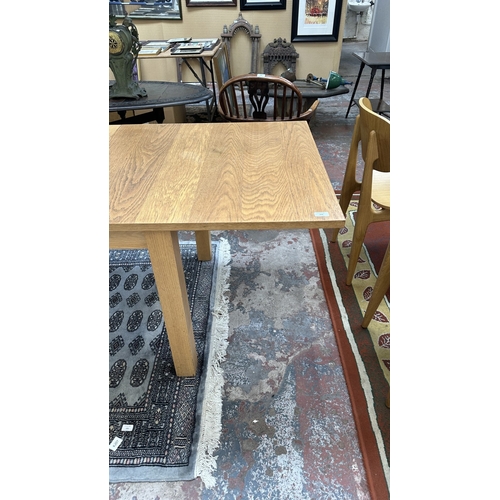 100 - A 1990s Habitat oak extending dining table designed by Terence Conran, made in Denmark - approx. 74c... 