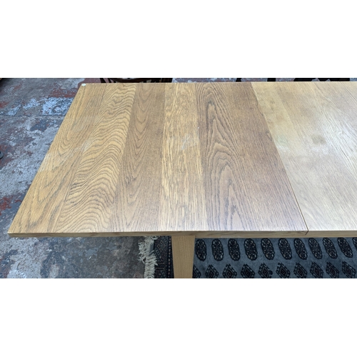 100 - A 1990s Habitat oak extending dining table designed by Terence Conran, made in Denmark - approx. 74c... 
