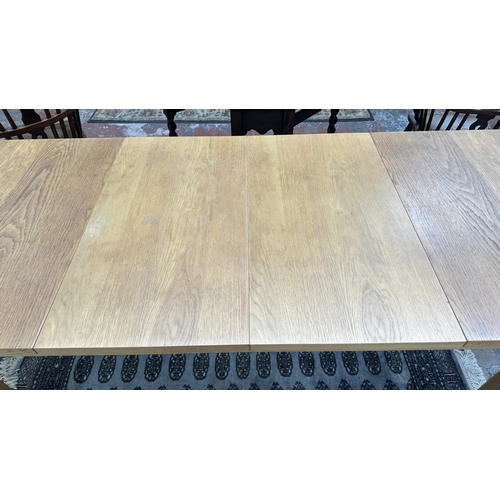 100 - A 1990s Habitat oak extending dining table designed by Terence Conran, made in Denmark - approx. 74c... 