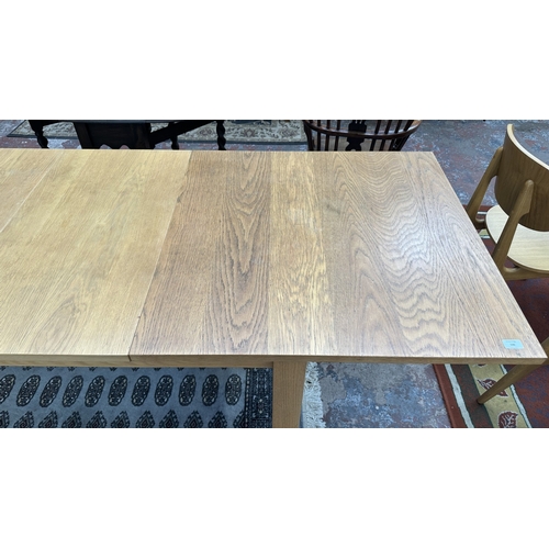 100 - A 1990s Habitat oak extending dining table designed by Terence Conran, made in Denmark - approx. 74c... 