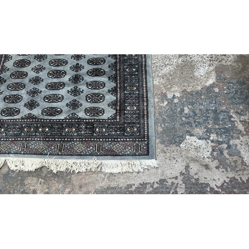 102 - A hand knotted Bokhara rug - approx. 200cm x 130cm