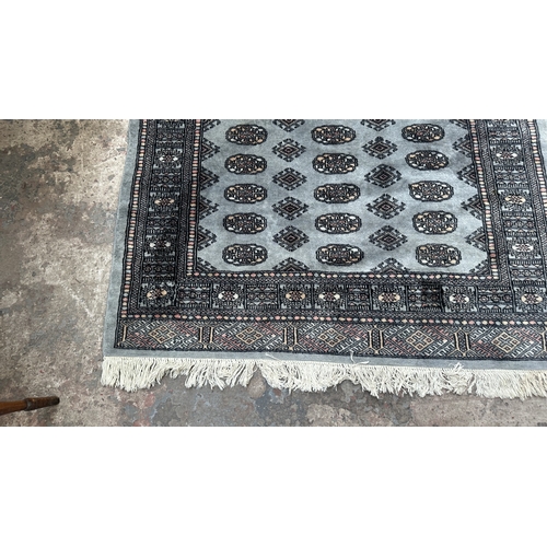 102 - A hand knotted Bokhara rug - approx. 200cm x 130cm
