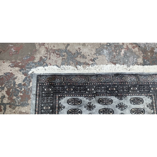 102 - A hand knotted Bokhara rug - approx. 200cm x 130cm