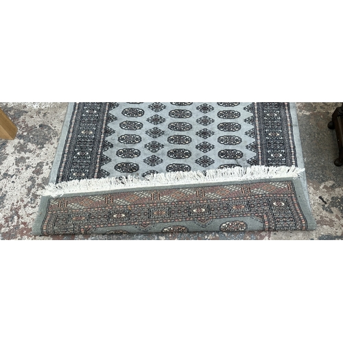 102 - A hand knotted Bokhara rug - approx. 200cm x 130cm