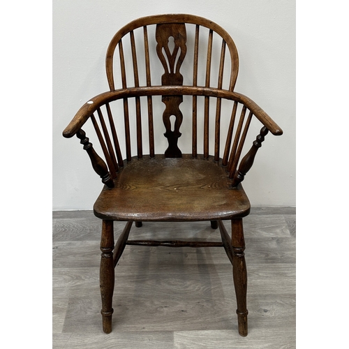 104 - A 19th century elm and ash Windsor armchair - approx. 88cm high x 63cm wide x 54cm deep