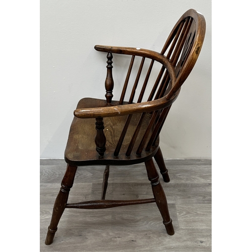 104 - A 19th century elm and ash Windsor armchair - approx. 88cm high x 63cm wide x 54cm deep